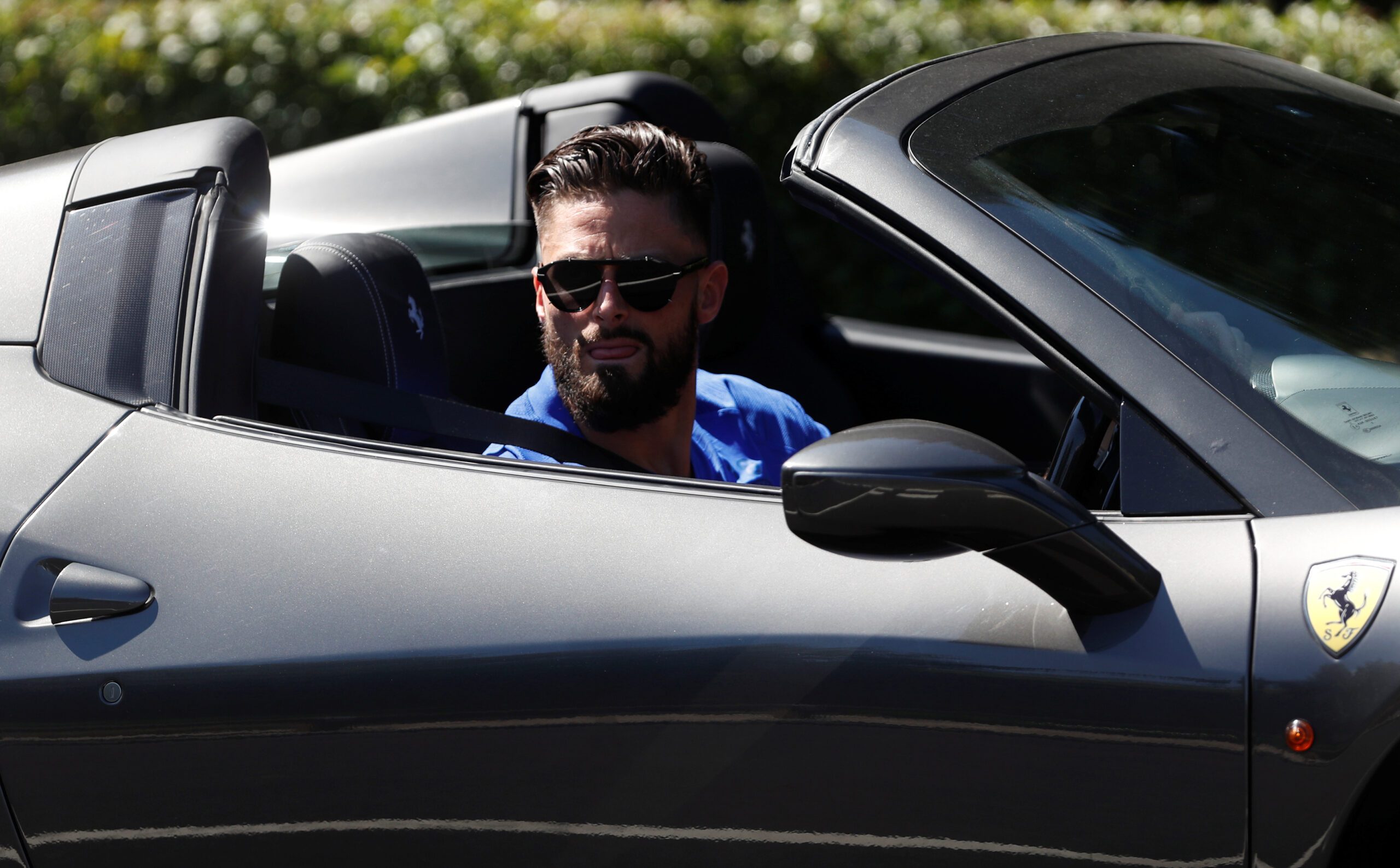 French star Olivier Giroud arrives to training in his Ferrari