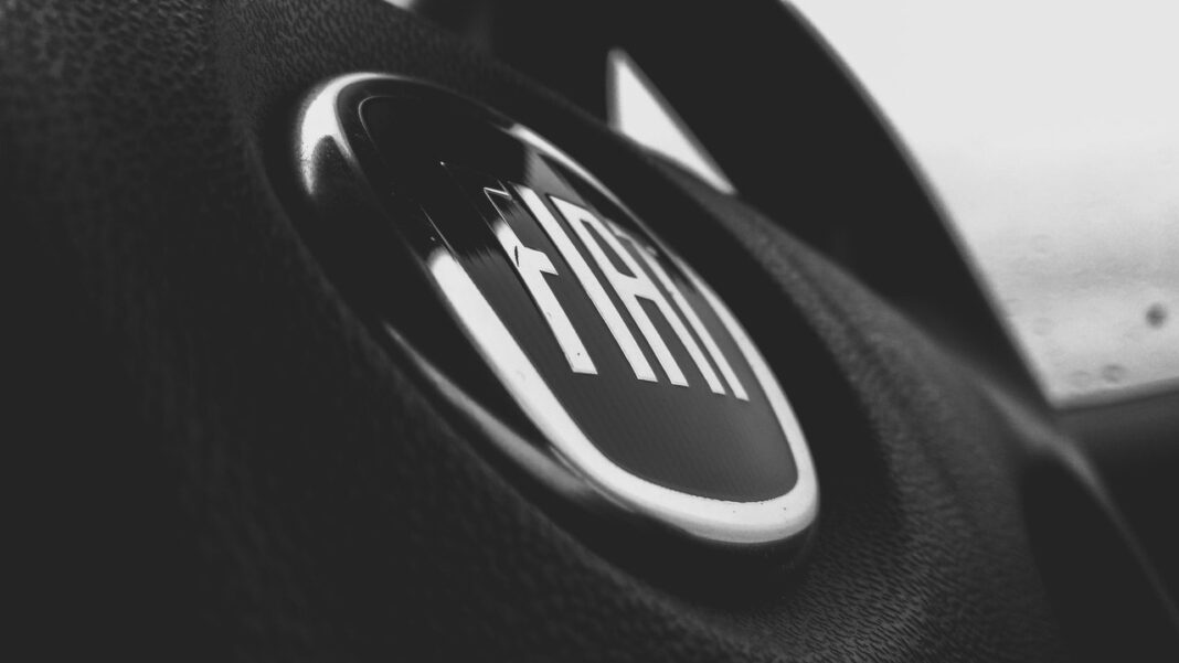 greyscale-and-closeup-photograph-of-fiat-steering-wheel-698699