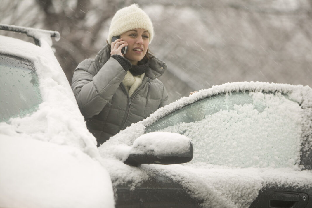 Woman on a Cell Phone in a Snow Storm